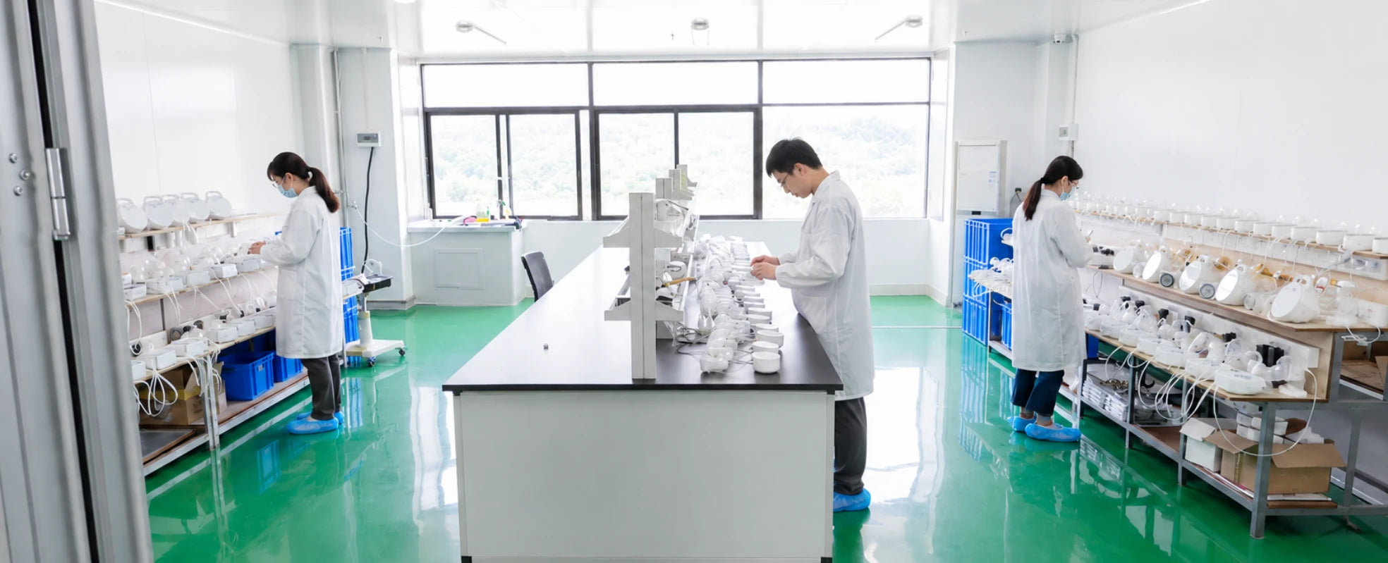 Momfree research and quality testing team inspecting breast pump components in the laboratory